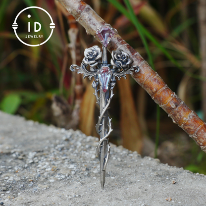 Handcrafted alexandrite pendant with rose and dagger details in oxidized silver – a symbolic talisman in gothic and witchcore style