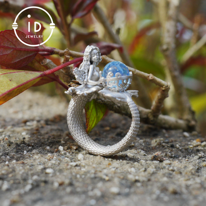 Handmade silver ring with seated mermaid and aquamarine stone, symbolic fantasy jewelry gift for women and ocean-inspired fairytale lovers