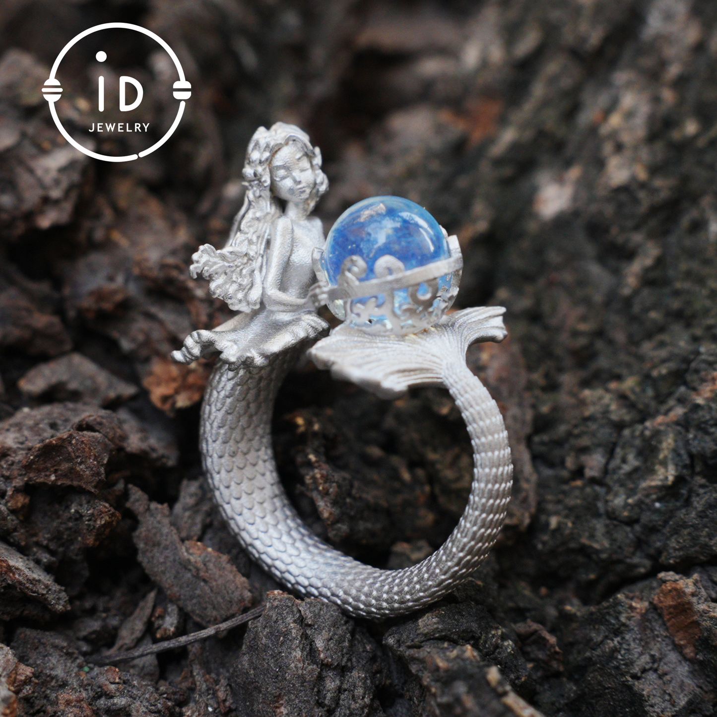 Handmade silver ring with seated mermaid and aquamarine stone, symbolic fantasy jewelry gift for women and ocean-inspired fairytale lovers