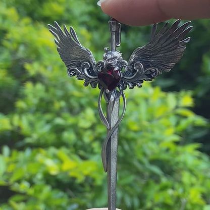 Gothic pendant with winged sword and heart-shaped garnet in oxidized 925 sterling silver, fantasy gift idea for her or cosplay events